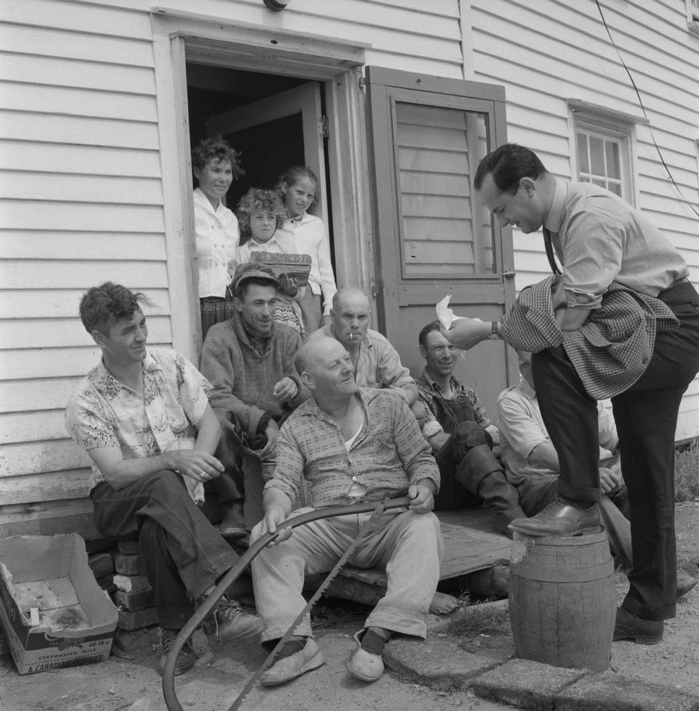 Fig. 6. Brooks, B. “Robert Wells, Dept. of Attorney General, discussing resettlement with Diver residents.” Library and Archives Canada, 3596332, National Fi…