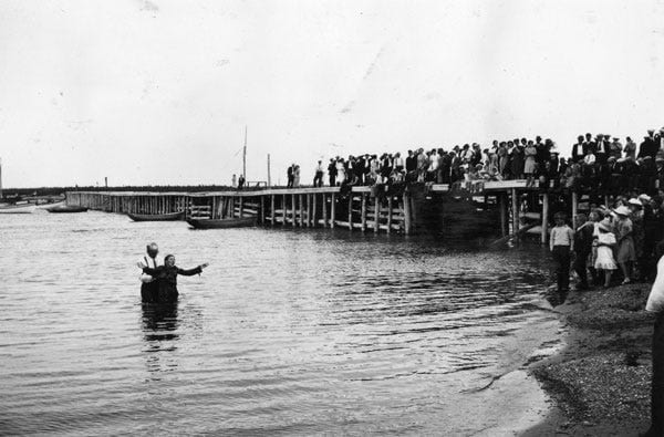 Fig. 63. Anderson, Gustav. “Baptism of Woman, Carmanville Harbour, Witnessed by Congregation.” The Rooms Archive, VA 14–226, Newfoundland Tourist Development…