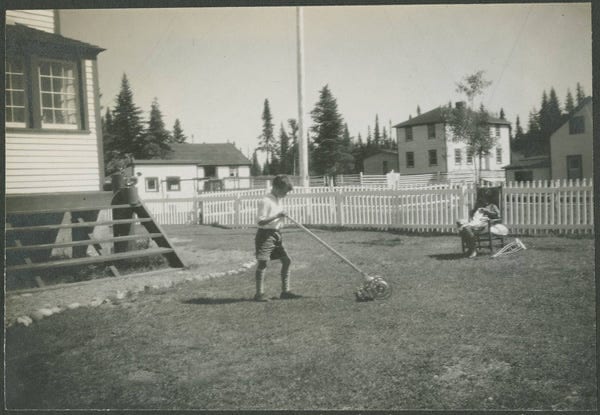 Fig. 65. Sears, Fred Coleman. “Dickie Paddon Mowing the Lawn.” The Rooms Archive, VA 110–20.1, International Grenfell Association Photograph Collection, 1930.