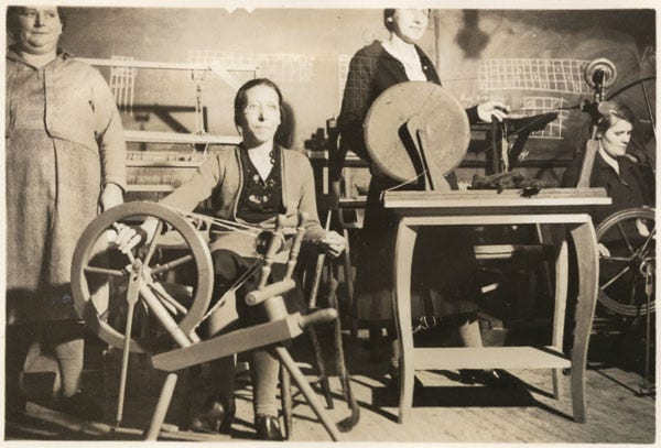 Fig. 74. Unknown. “Women Spinning Wool.” The Rooms Archive, VA 56–5.1, Newfoundland Rural Reconstruction Photographs, ca 1939–40.